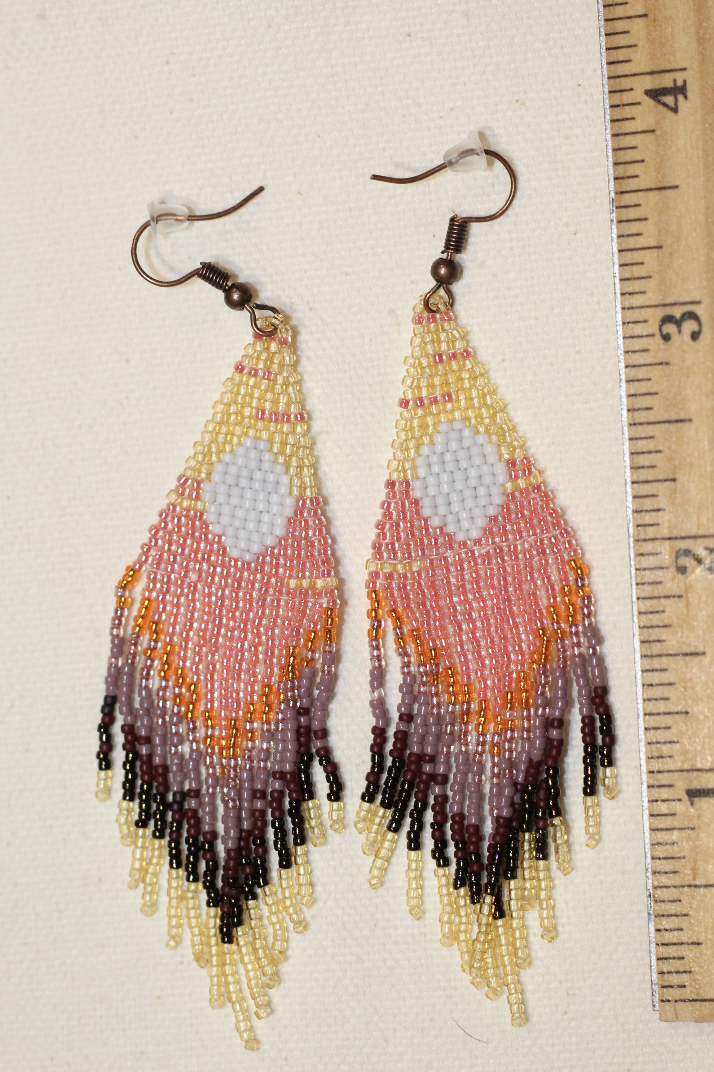 Sunrise Circle Statement Earrings next to a ruler showing the length to be 3.75 inches